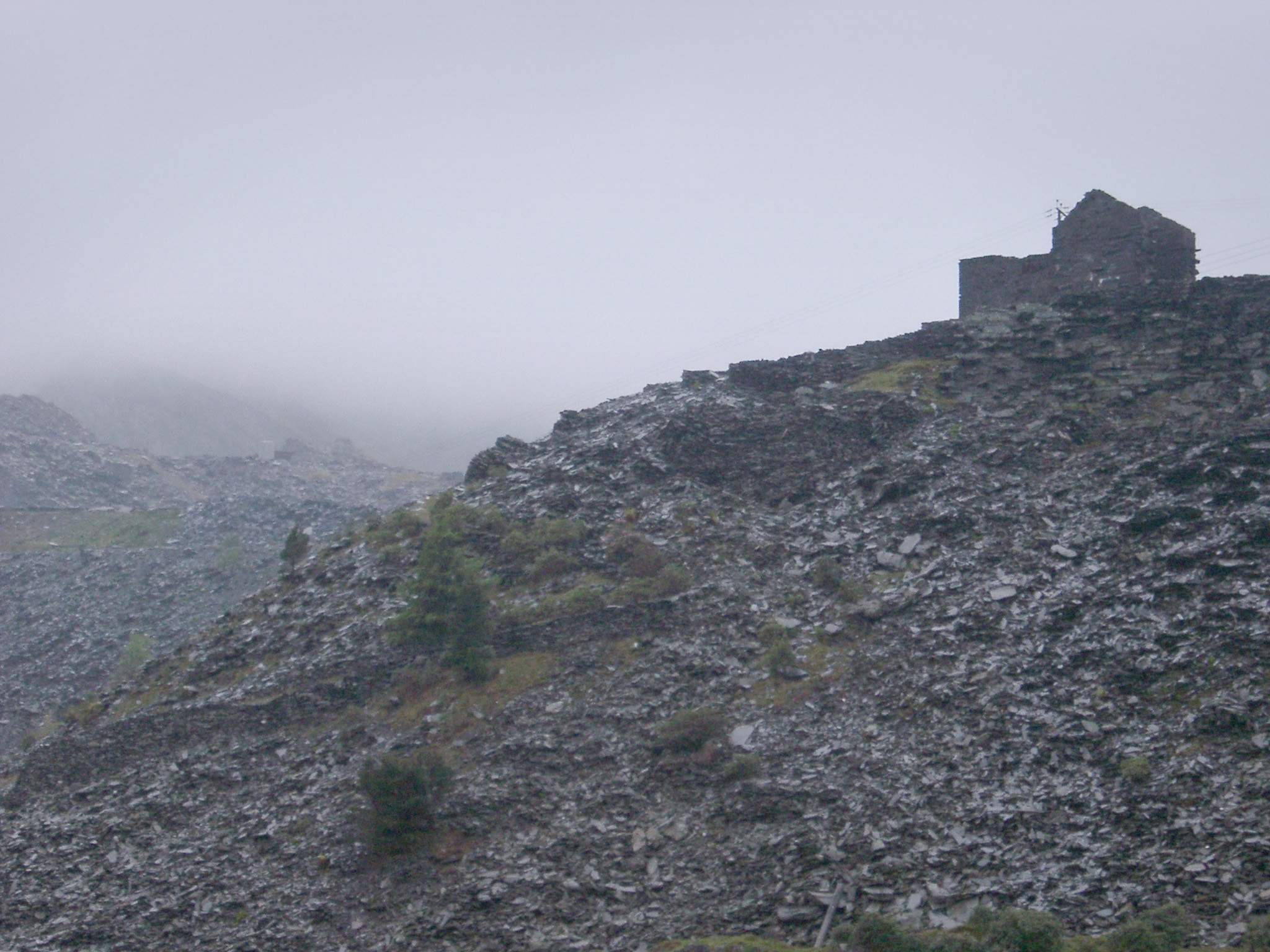 an image of Stone Building on Rocky Hill in Rainy Weather, Blaenau Ffestiniog, a Historic Mining Town in Gwynedd, North Wales