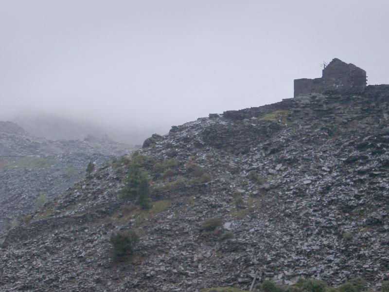 Stone Building on Rocky Hill in Blaenau Ffestiniog Stone Building on Rocky Hill in Rainy Weather, Blaenau Ffestiniog, a Historic Mining Town in Gwynedd, North Wales