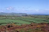 Scenic agricultural landscape with a patchwork of lush green corn fields on the Llyn peninsula overlooking the Irish Sea
