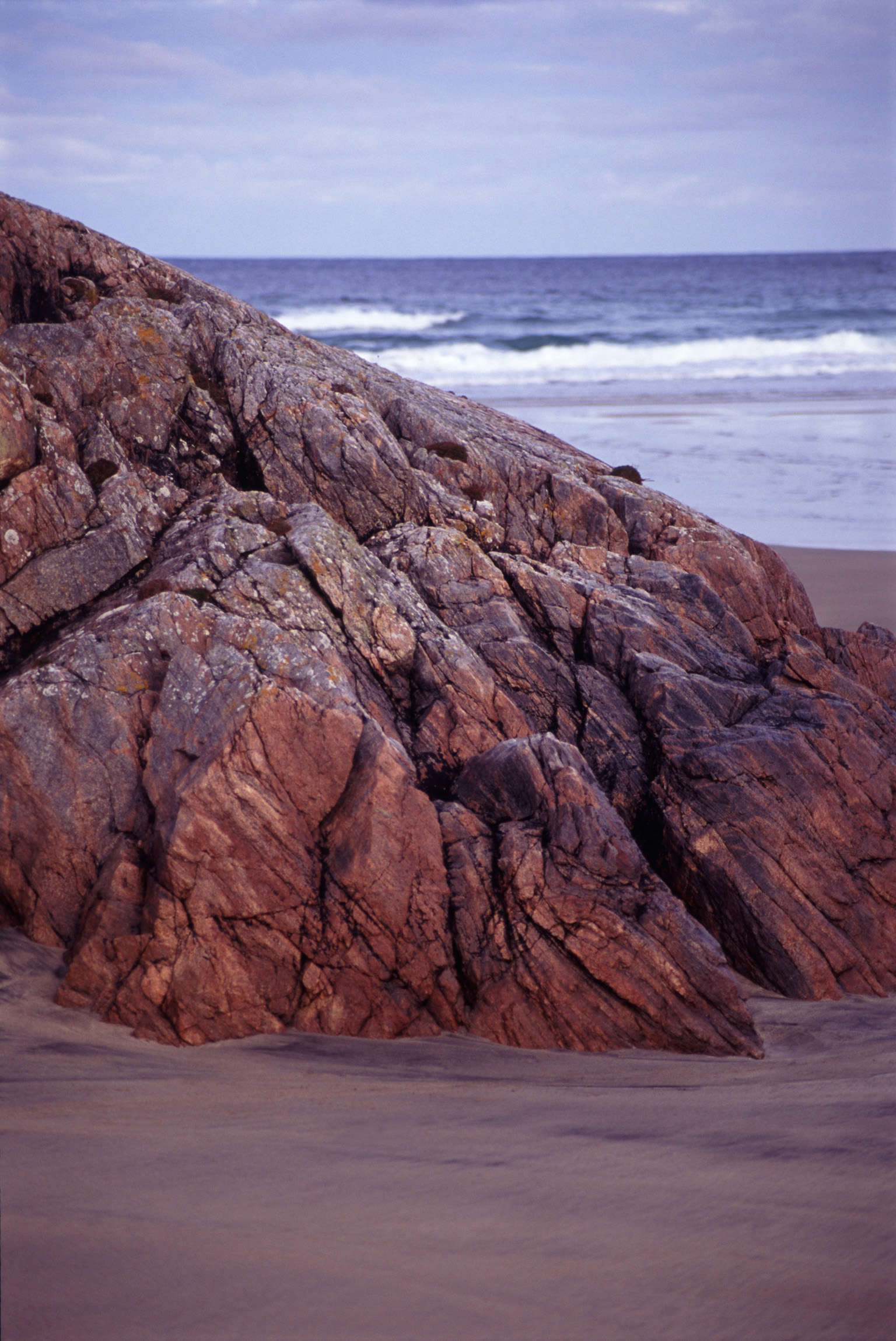an image of Coastal Rock Formation on Overcast Beach in Lewis, Hebrides, Scotland