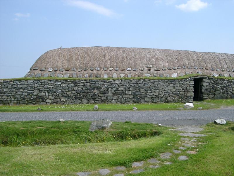 Typical historic blackhouse on the Hebrides with its thatched roof and double drystone walls inside which an open fire was built, but as it had no chimney the smoke had to escape through the thatched roof
