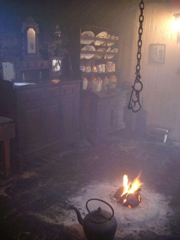 smoky dark interior of a blackhouse, a historic traditional scotts highland dwelling without glass windows
