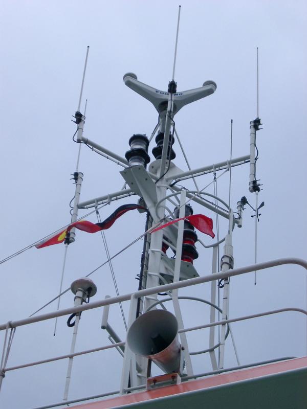 Detail of Ferry Boat Radar and Horn Looking Up at Detail of Ferry Boat Radar and Horn Against Overcast Sky