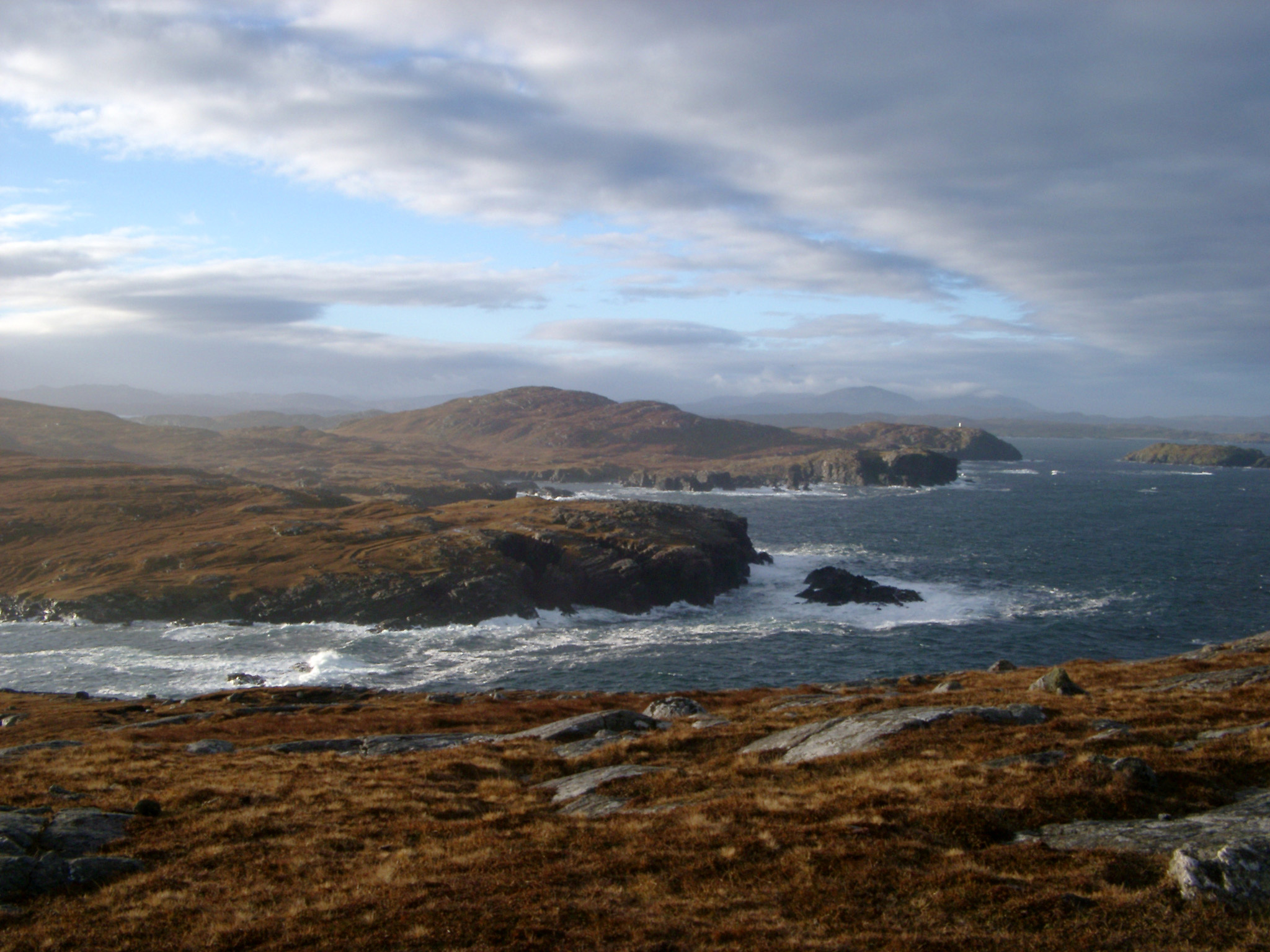 an image of Extensive View of Relaxing Seascape View with Grassy Ground and Splashing Sea Water View at Scotland.
