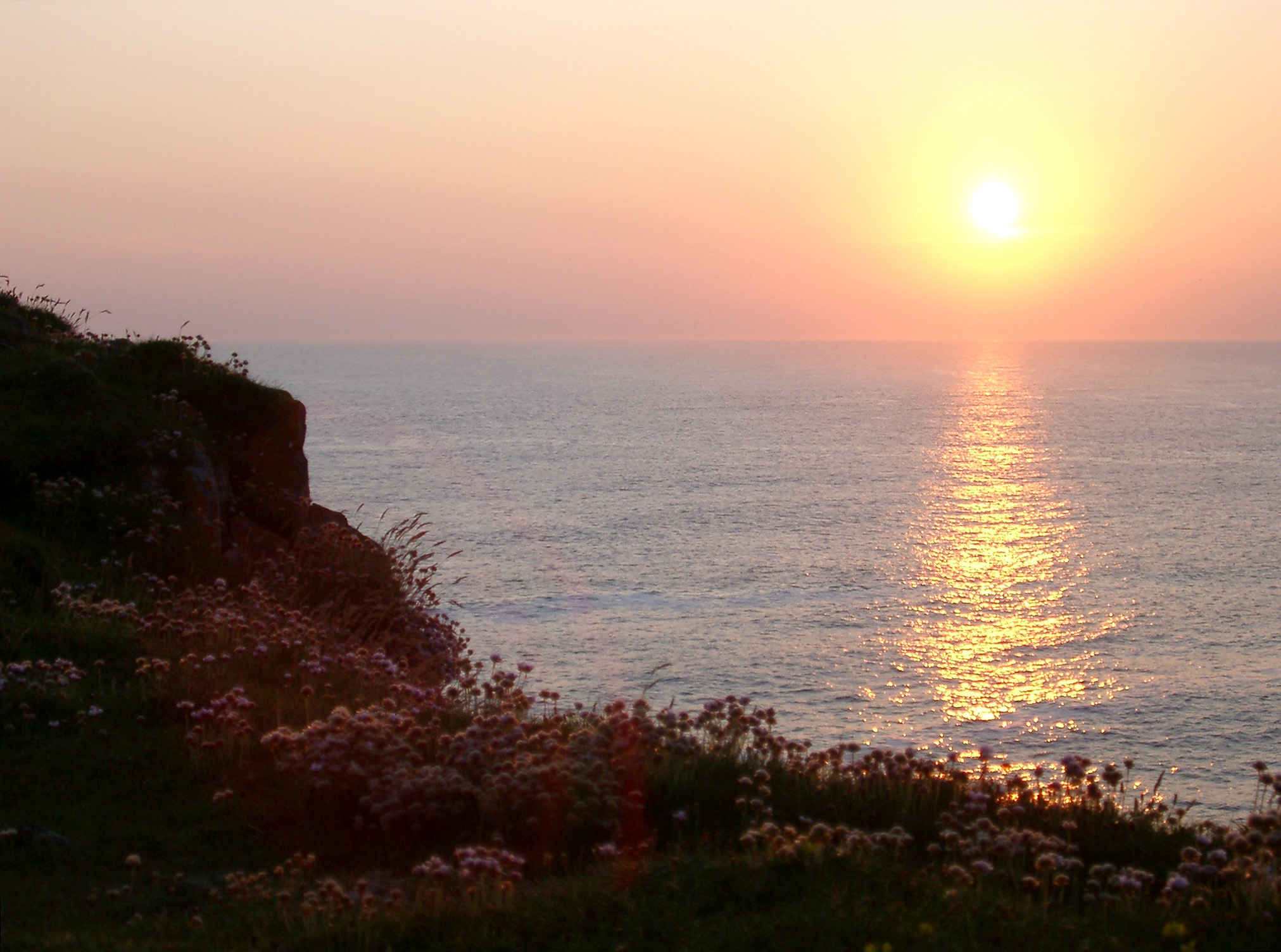 an image of Scenic of Sunset Over North Atlantic Ocean as seen from Cliffs of Butt of Lewis, Outer Hebrides, Scotland