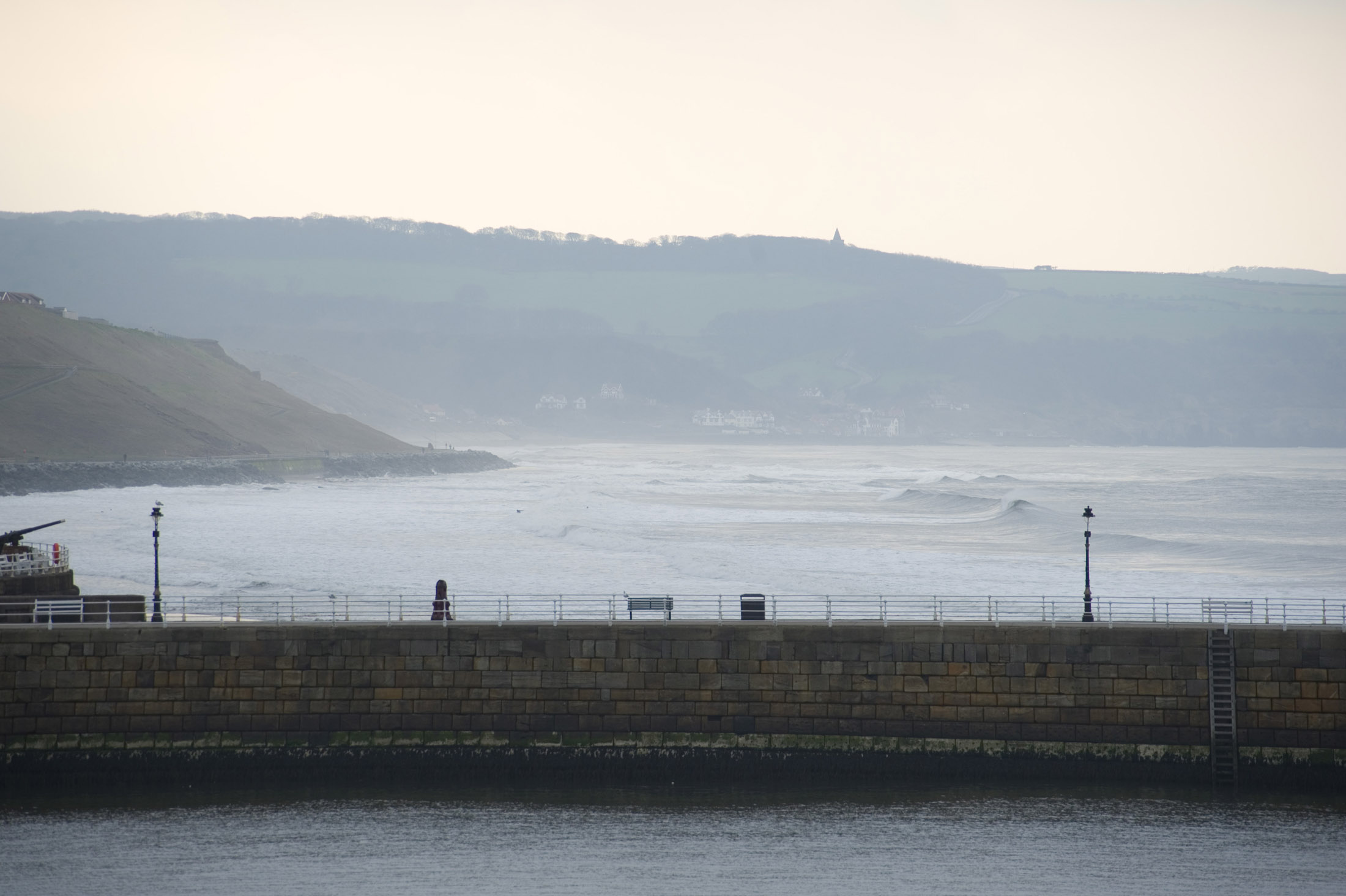 an image of looking up the coast to sandsend in the distance from whitby