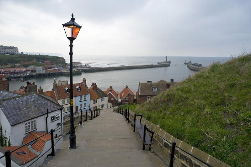the 199 steps and harbour a view down whitbys famous 199 steps towards the harbour seawalls and town