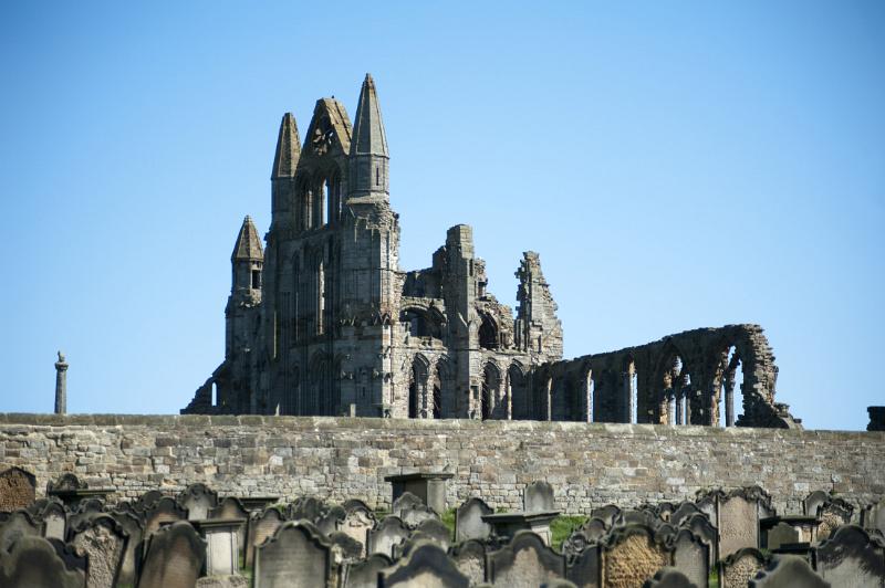 the ruins of whitby abbey viewed from the graveyard of st marys church