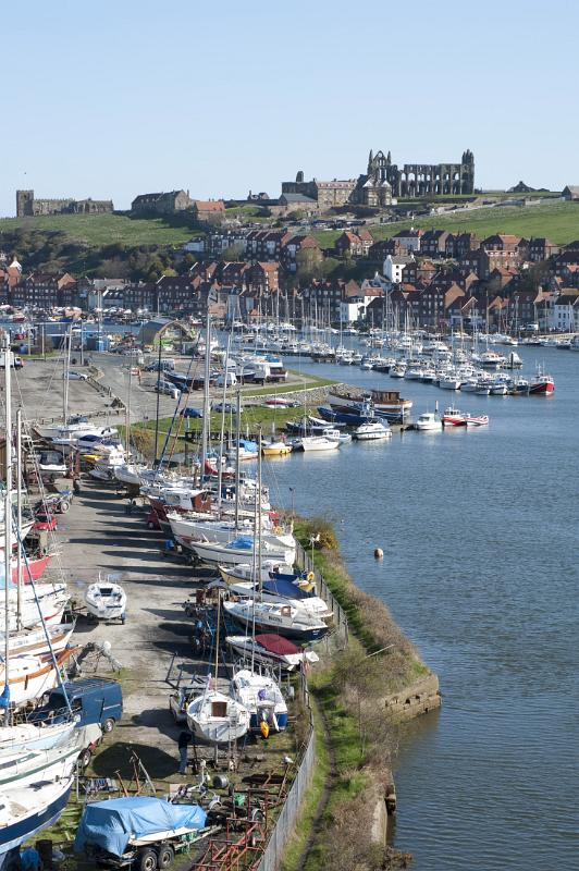 boats moored on the banks of the river esk flowing through whitby