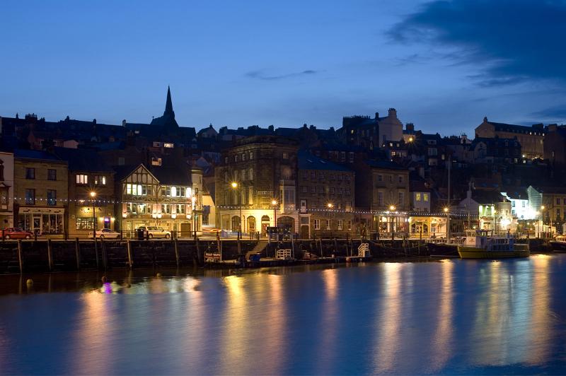 a view of st annes staith whitby, lit up at light