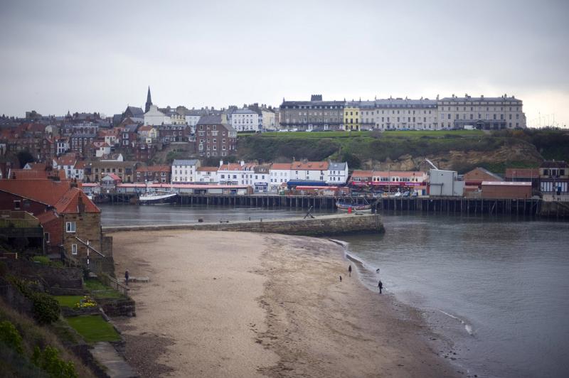 tate hill beach a view of tate hill sands and whitbys west cliff across the harbour on a wet day