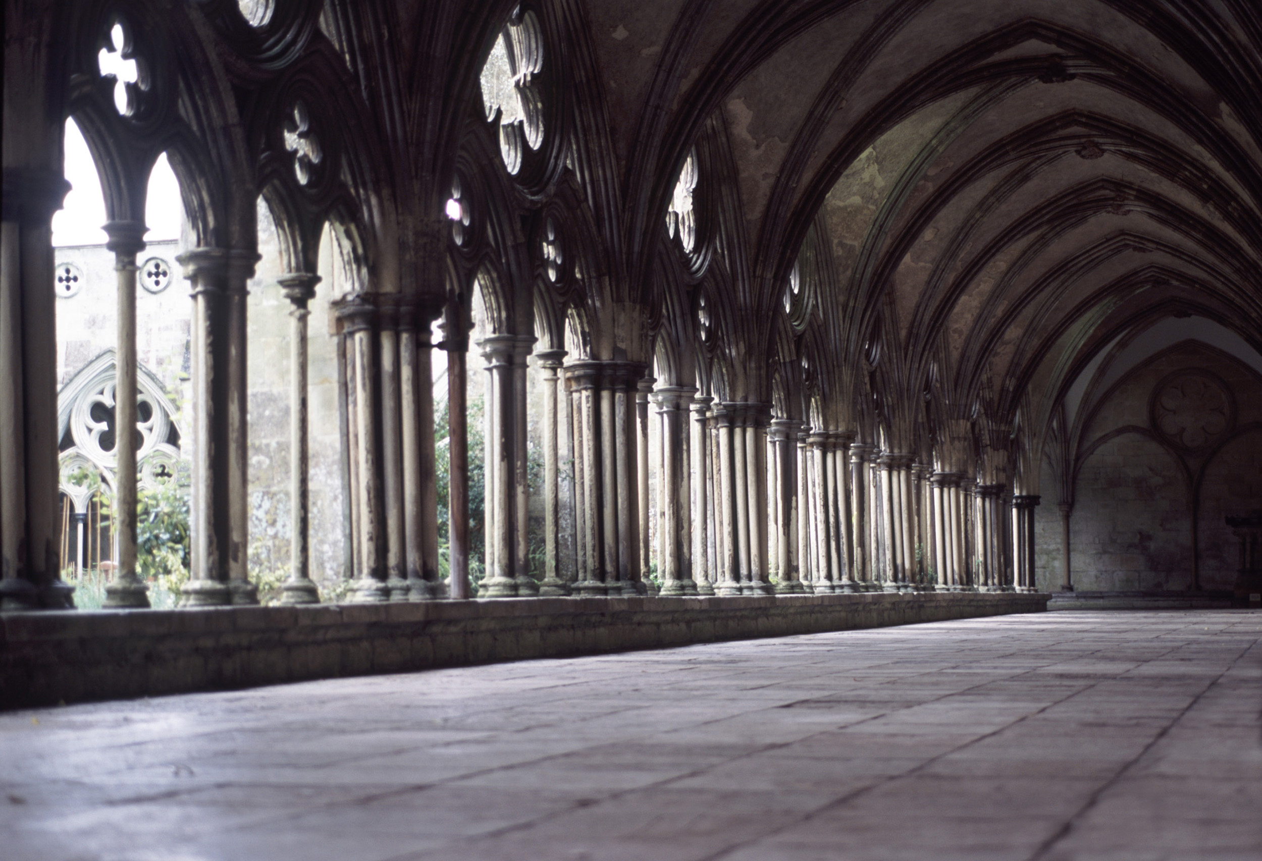 an image of stone cloisters enclose a courtyard at salisburys medieval cathedral