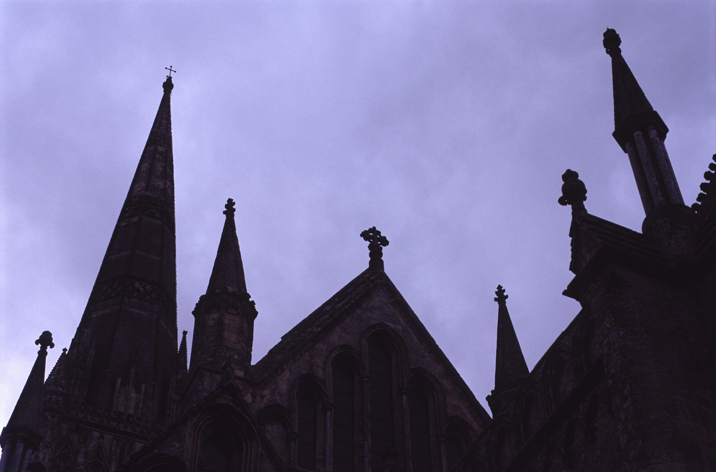 an image of salisbury cathedral in silhouette