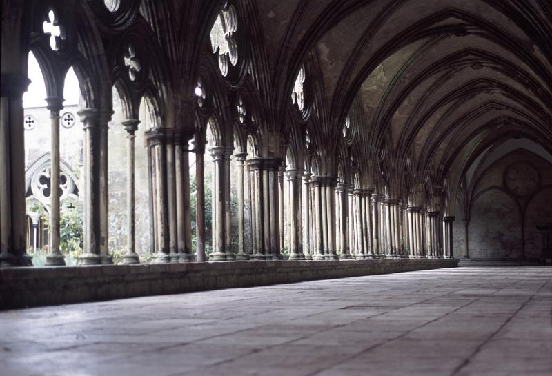 stone cloisters enclose a courtyard at salisburys medieval cathedral