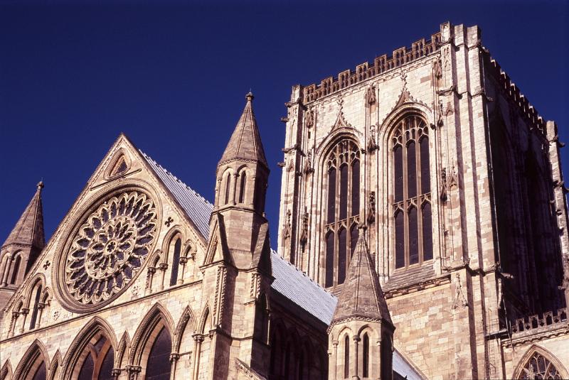A view of York Minster against a deep blue sky