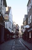 The Shambles, York, a tourist trap with quaint shops lining a narrow cobbled street in a picturesque view