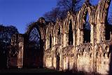 Famous York Landmark - Ruins of St Mary's Abbey with Leafless Trees at the Background. Captured at Sunset Time.