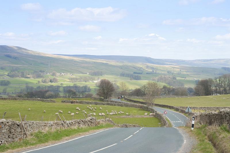 winding country road snakes it's way through the yorkshire dales national park