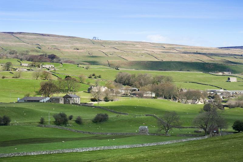 a patchwork a fields and farm buildings in the yorkshire dales