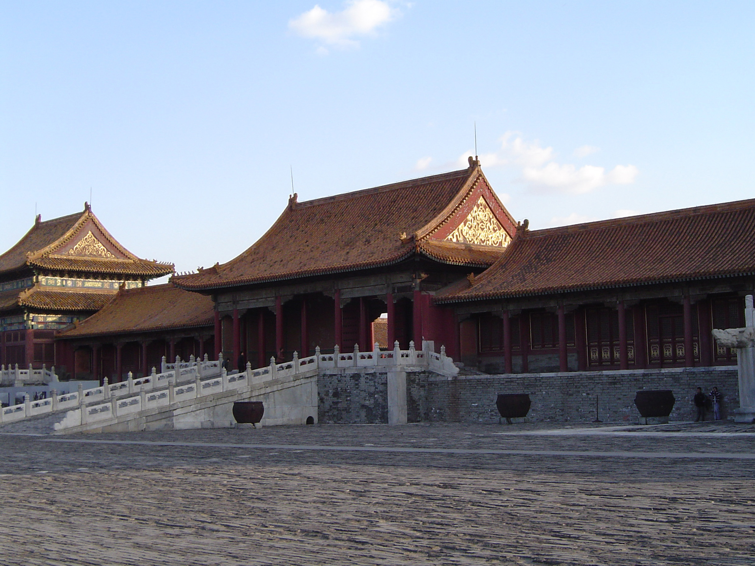 an image of Famous Attraction of Vintage Architectural Forbidden City Temple in China on Lighter Blue Sky Background.