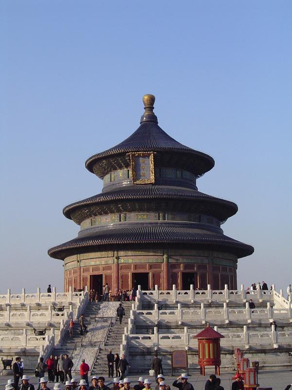 Famous Historic Temple of Heaven in China Famous Huge Historic Temple of Heaven in China, Known as Hall of Prayer for Good Harvests. Captured with Random Visitors on Light Blue Gray Sky Background.