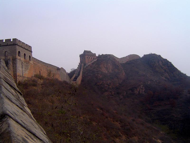 Famous Stone Made Great Wall of China on Hills. One of the Wonders of the World. Captured on Very Light Blue Sky Background.