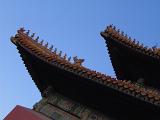 Artistic Details of Famous Vintage The Forbidden City Palace in Beijing, China on Light Blue Sky Background.