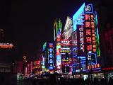 Attractive Glowing Neon Lights From Various Establishments in a Chinese City During Night Time.