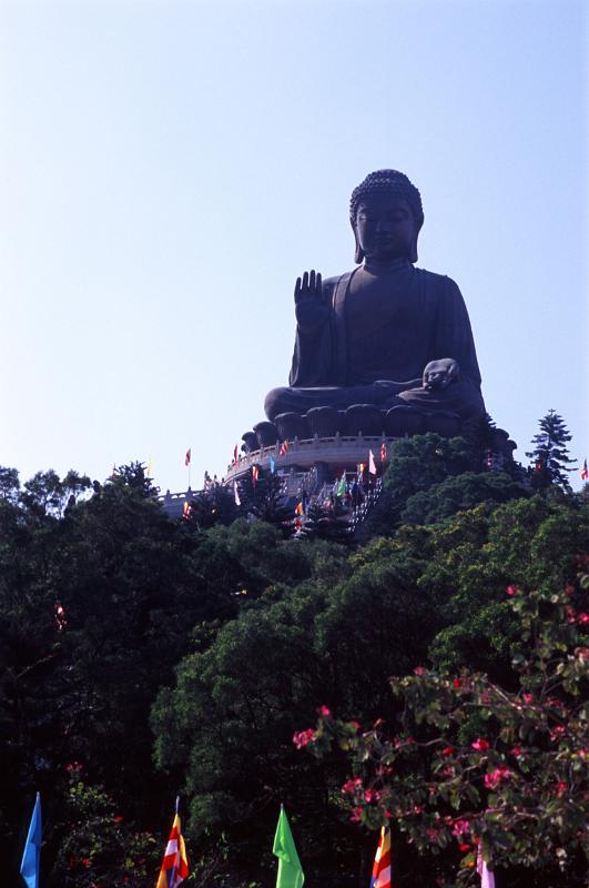 Famous Vintage Big Tian Tan Buddha Structure in Lantau Island, Hong Kong. Surrounded by Tall Green Trees.