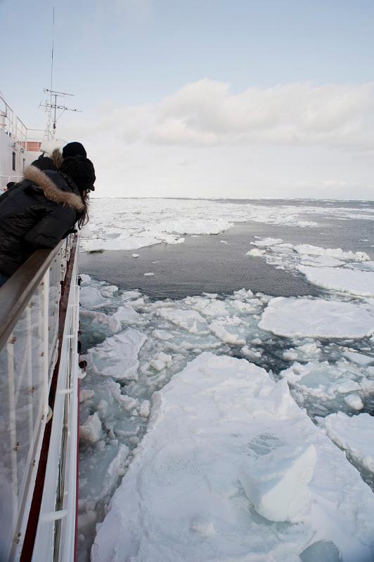 Breaking through ice drifts onboard the Aurora ice breaker, Hokkaido, Japan