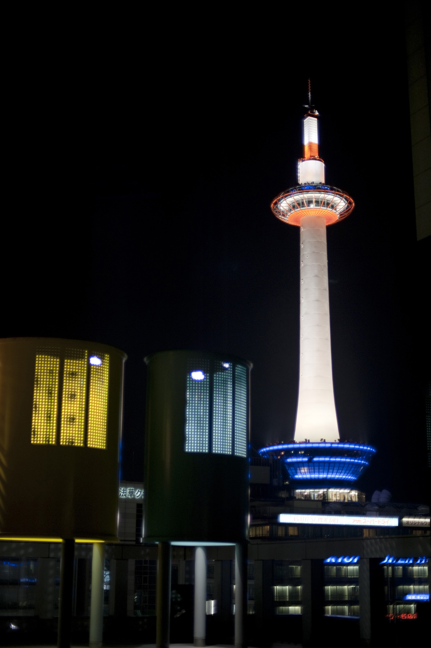 an image of The Kyoto-tawa; kyoto tower illuminated at night, Kyoto, Japan