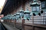 Kasuga Grand Shrine (Kasuga-taisha) a Shinto shrine in Nara, Japan, lines of brass lanterns or kondo-doro