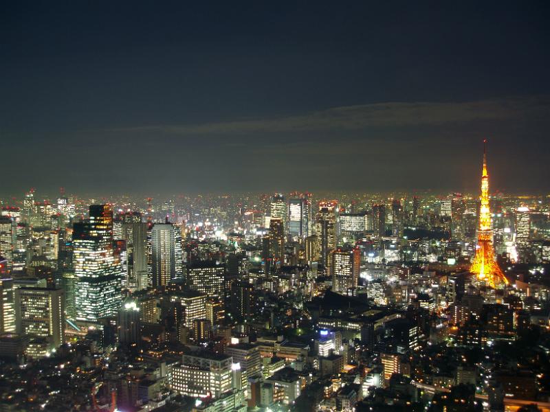 view of tokyo tv tower and surrounding areas at night the the tower illuminated
