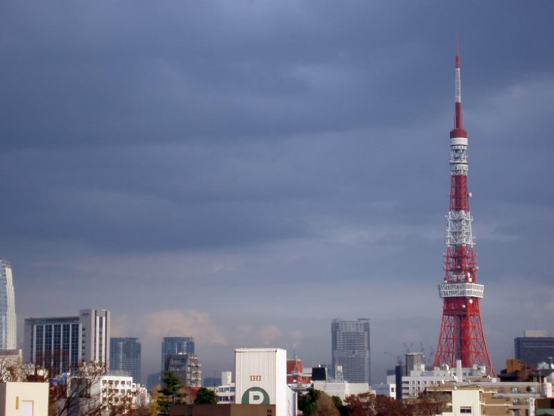 stormy sky with the tokyo tv tower at other buildings, tokyo, japan