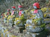 a row of jizo statues, nikko, japan