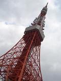 a view of the tokyo tv tower looking up at the metal structure