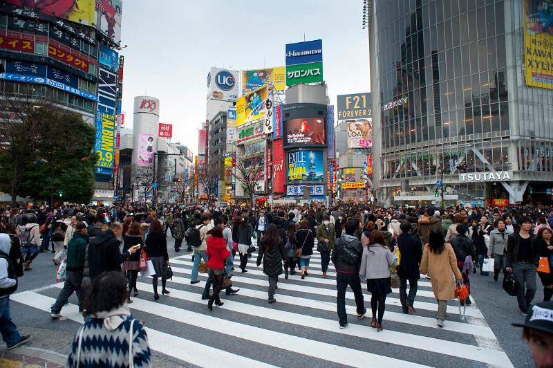 flashy advertisings and crowded streets are a feature of the shopping district in shibuya, tokyo, japan