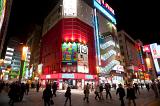 brightly lit stores at night in akihabara - electric town, tokyo, japan