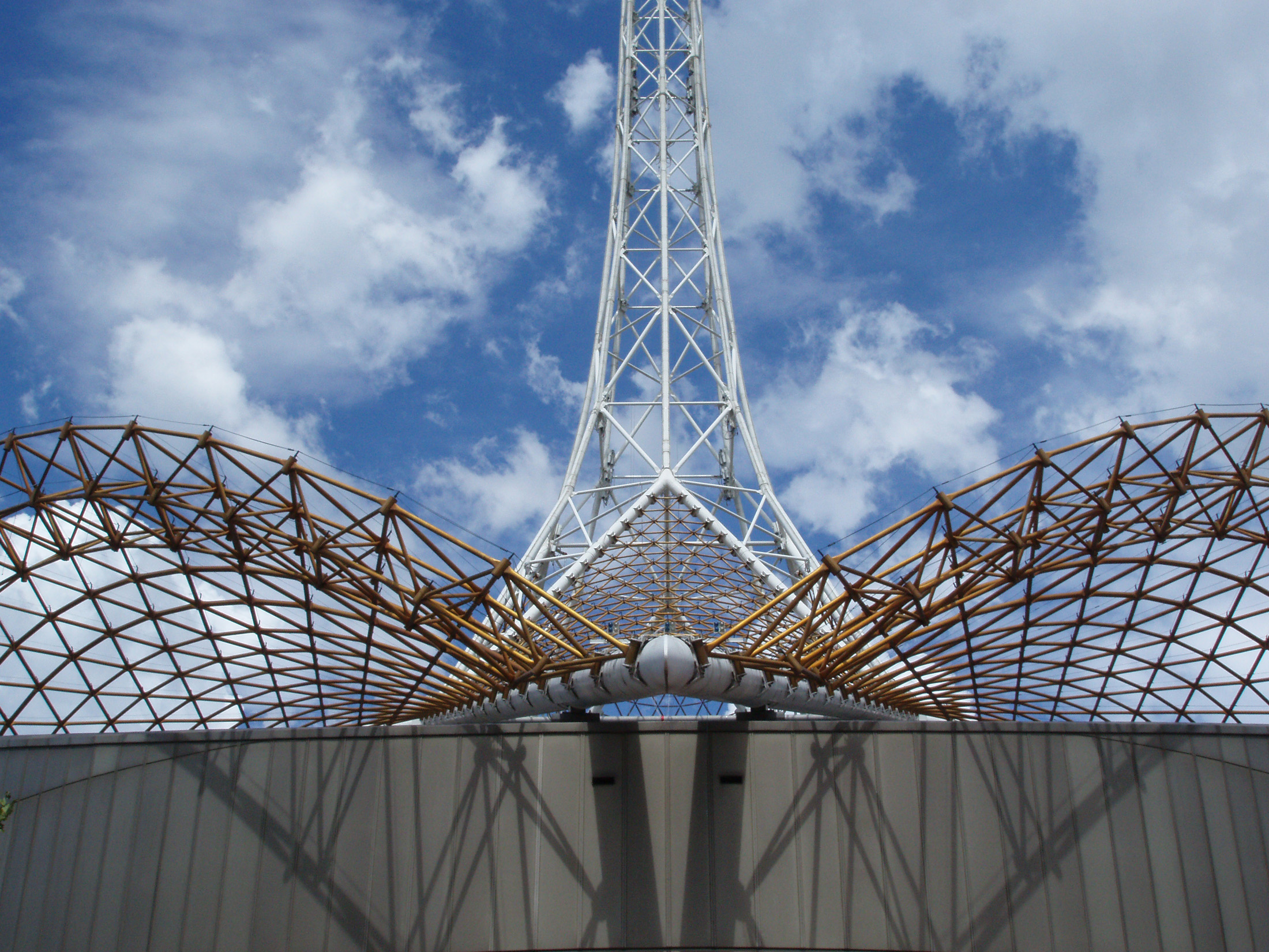 an image of Close up of Famous Melbourne Landmark - The Arts Centre Spire on Cloudy Sky Background.