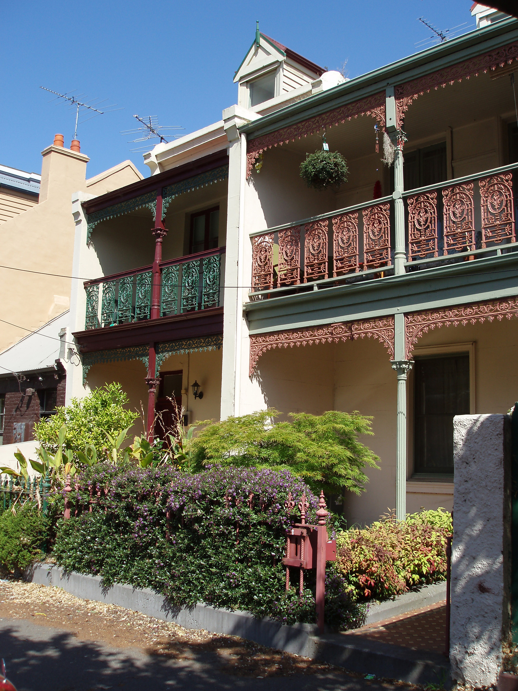 an image of Exterior Design of Australian House Building with Terrace and Mini Garden in Front Located in Melbourne