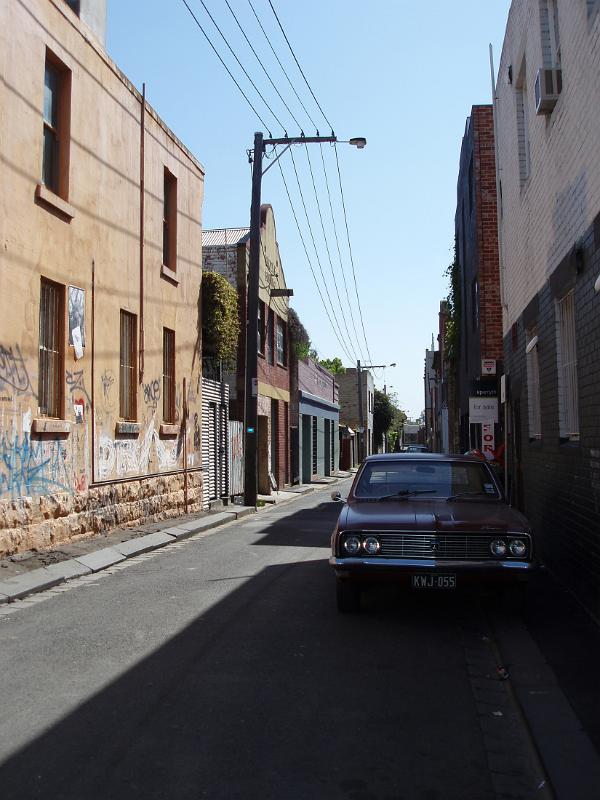 Car Parking at Fitzroy Street Between Vintage Tall Buildings at Melbourne. Captured at Morning Time.