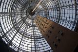 A vertical, mesmerizing view of the glass cone, an architectural masterpiece in Melbourne Central shoppung centre, Australia.
