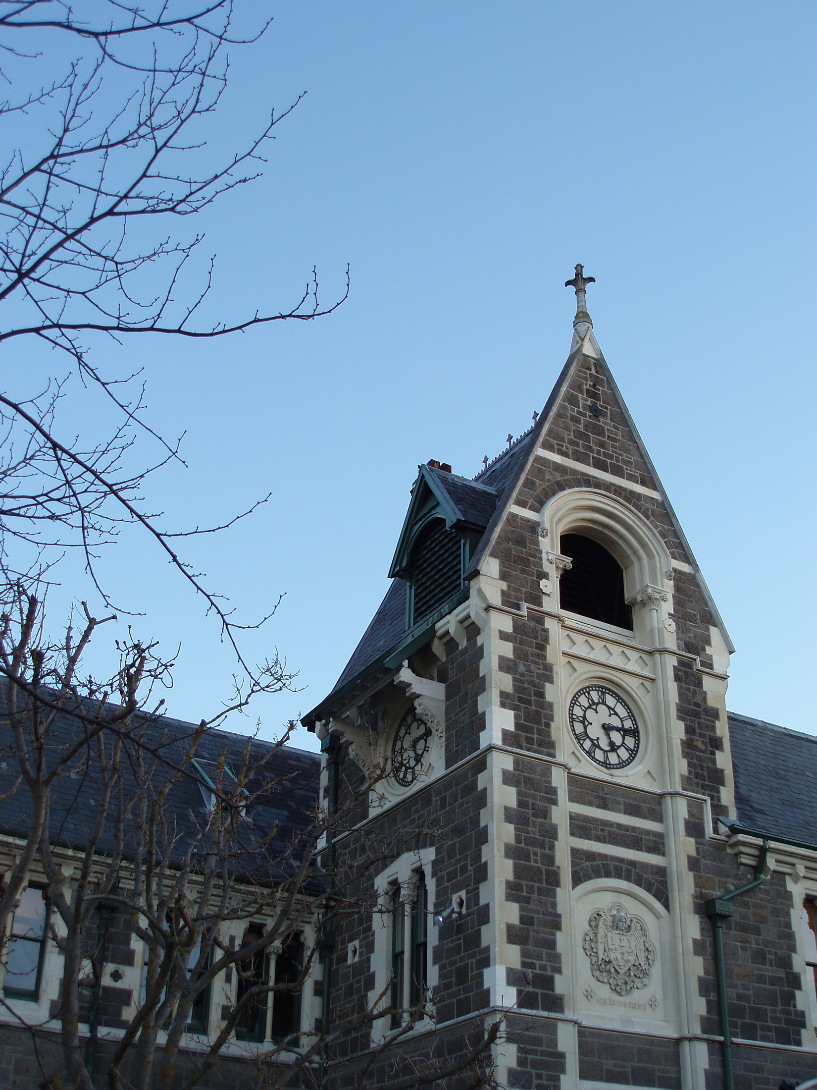 an image of clock tower on the former university of canterbury bulidings, christchurch