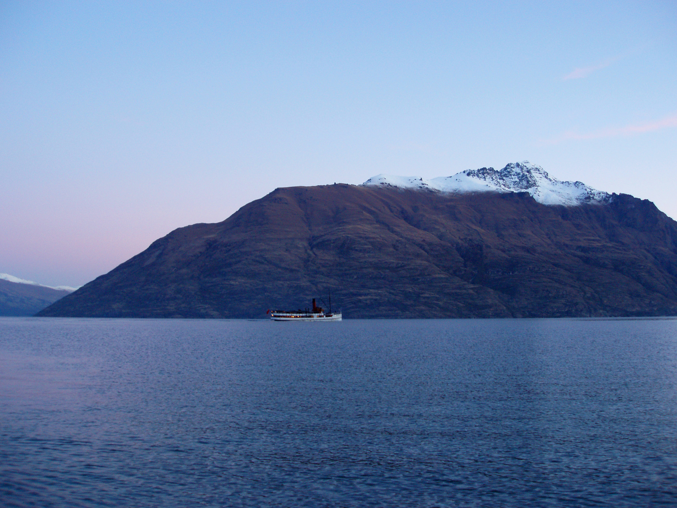 an image of the TSS earnslaw streamer on lake wakatipu, queenstown, at sunset