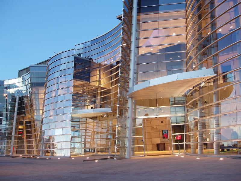reflective glass font of the christchurch art gallery at sunset,