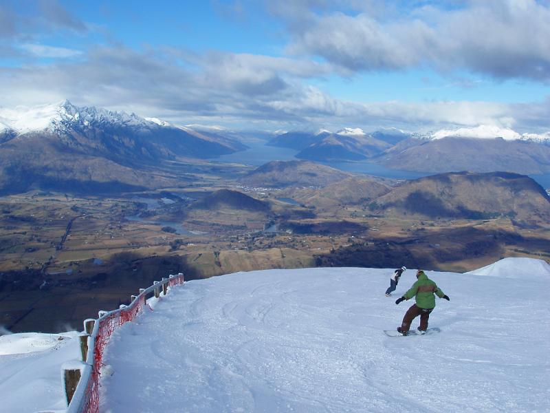 spectacular place for winter sports, snowboarder on the piste at coronet peak