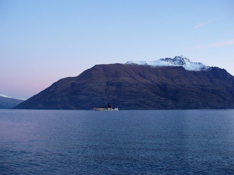the TSS earnslaw streamer on lake wakatipu, queenstown, at sunset