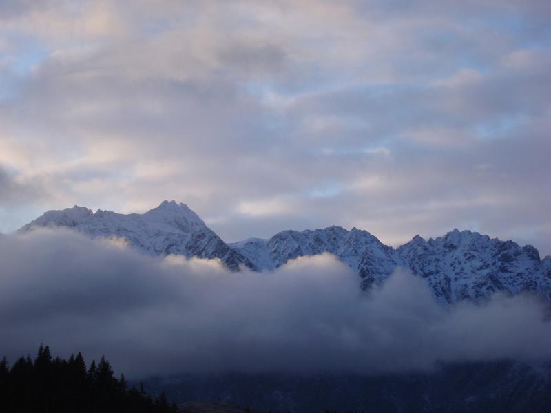 clouded montain range, the remarkables as seen from queenstown, newzealand in winter