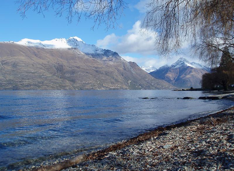 serene waters lake seen from the shores of lake wakatipu in queenstown