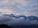 clouded montain range, the remarkables as seen from queenstown, newzealand in winter